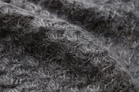 Dark gray woolen natural texture, knitted textile background, close-upの写真素材