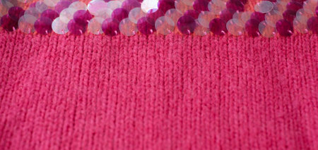 Pink woolen natural texture background with decor, knitted textile background