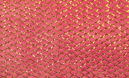 gold mesh on pink background for decoration of bouquets, decor, needlework, interiorの写真素材