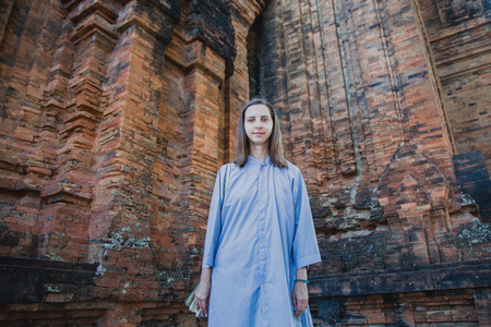 2017. The girl is traveling. Nha Trang, the Cham tower. Clothes of monks.の写真素材
