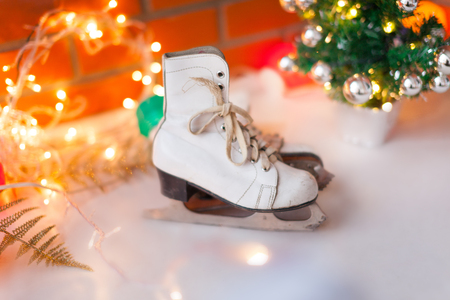 Christmas and New Year background with Eve Tree decorations. White retro skates. winter sports. の写真素材