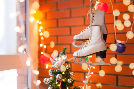 Christmas and New Year background with Eve Tree decorations. White retro skates. winter sports. の写真素材