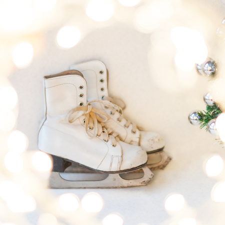 Christmas and New Year background with Eve Tree decorations. White retro skates. winter sports. の写真素材