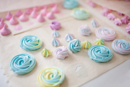 Closeup homemade multicolor meringue cookies.