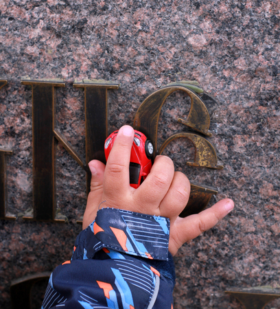 Machine in the hand of a little boyの写真素材