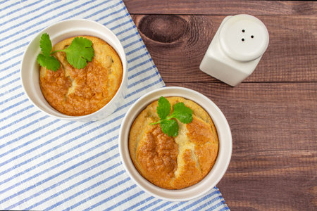 Baked egg omelet for two, crisp and greens. Fresh healthy breakfast, top viewの写真素材