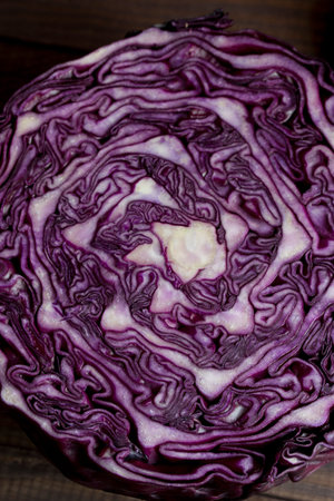 Red cabbage purple cross section close-up on a dark backgroundの写真素材