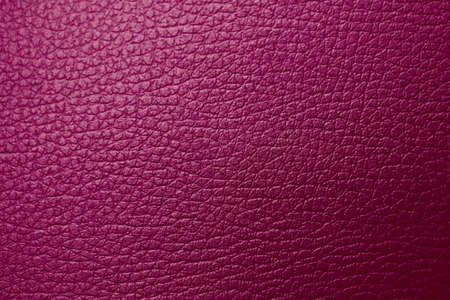 Texture of genuine leather raspberry burgundy maroon red magenta tone. Backdrop background textured effect for design. Artificial eco leather piece of artificial fake skinの写真素材