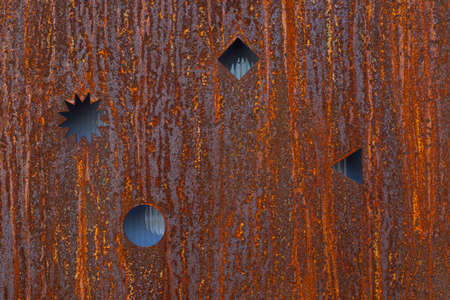 Rusty metal with cuts and traces of corrosion and rustの写真素材