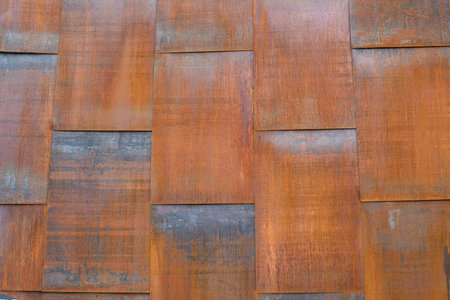 The surface is made of rusty iron sheets in the shape of a rectangle. Texture background backdrop