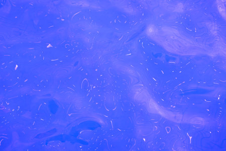 Blue slime texture with highlights, liquid water surface, abstract background