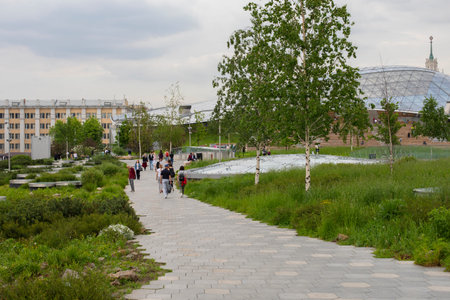 Moscow, Russia - May 28, 2021: Zaryadye park in the center of the capital a paved path and a green lawn, a modern fashionable recreation place in Moscow outdoor. Landmark of Moscowのeditorial素材