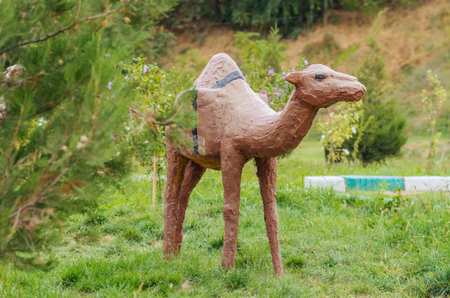 A funny little dromedary sculpture in a public park in Shymkent, Kazakhstanの写真素材