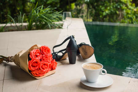 Morning after party. High heeled sandals and latteの写真素材