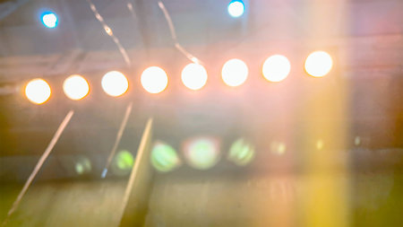 Abstract light glow color golden yellow pink blue green. Illumination shine. Electric neon light. Soft focus. film grain pixel texture. Defocused. Blur. Wallpaper. Background. Lamp shine.の写真素材