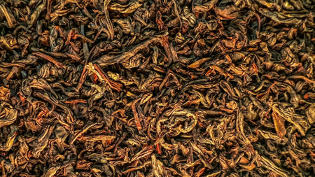 Macro texture of dry tea leaves. Close-up view of green red black teat leaves. Ceylon tea. Market Wallpaper. Measuring English tea. Soft focus. film grain pixel texture. Defocused.の写真素材