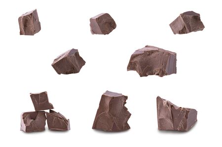 Set of dark broken chocolate pieces isolated on white backgroundの写真素材
