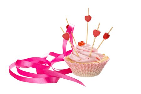 Pink cream puff with a ribbon isolated on white backgroundの写真素材