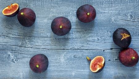 Fig fruit on grey blue rustic wooden background, top viewの写真素材