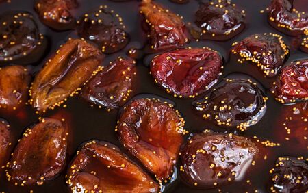 Fig jam. Cooked Fig jam with fruit berries in liquid jelly, close-up.の写真素材