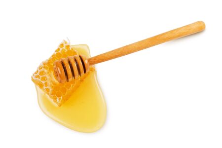 Honey, honeycomb piece and wooden dipper isolated on white background, top viewの写真素材