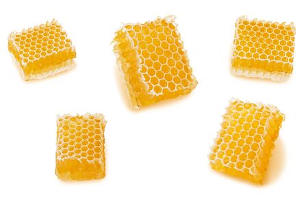 Set of honeycomb part with wax and liquid natural yellow honey isolated on white backgroundの写真素材