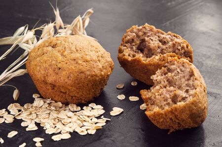 Homemade cakes from oat flour , oatmeal and wheat ears on  dark background. Ð¡oncept of home made healthy foodの写真素材
