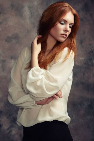 Portrait of beautiful woman with fresh makeup and romantic  hairstyle. Fashion photoの写真素材