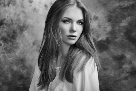 Portrait of beautiful woman with fresh makeup and romantic  hairstyle. Fashion photoの写真素材