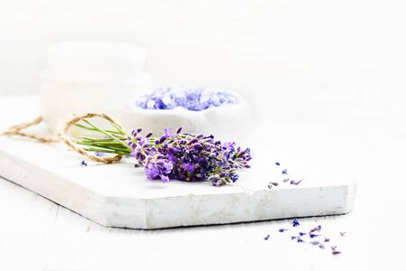 Bunch of lavender flowers on a white wooden background, copy space .の写真素材