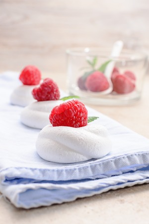 Pavlova - mini meringue cake with raspberries , copy space, close up, selective focus.の写真素材