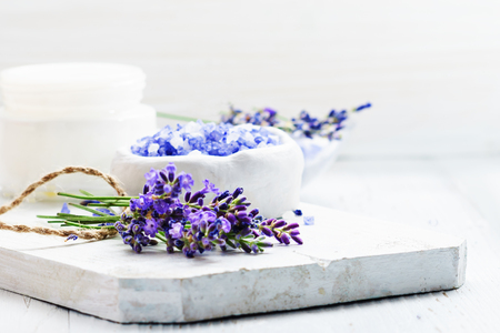 ingredients for lavender spa, flower and salt on white wooden background.の写真素材
