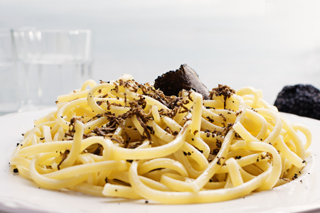 Strangozzi, italian wheat pasta with truffle on a light background.の写真素材