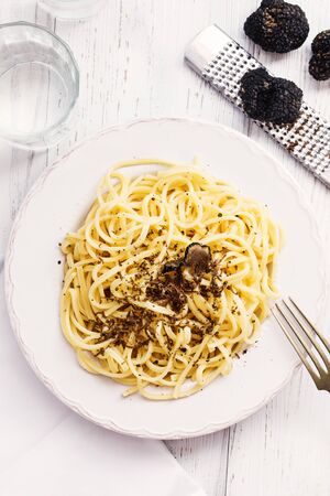 Strangozzi, italian wheat pasta with truffle on a light background.の写真素材