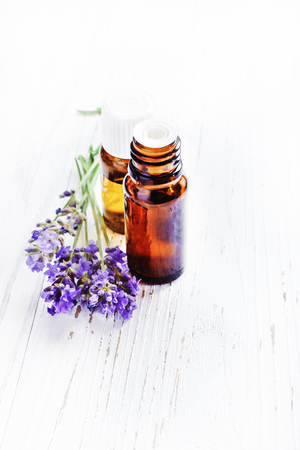 lavender essential oil with lavender on white background.の写真素材