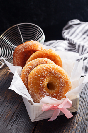 Graffe - tipical carnival italian doughnut  on black wooden board, copy space.の写真素材