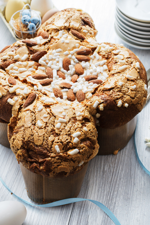 Colomba - italian easter dove cake on old rustic white wooden board.の写真素材