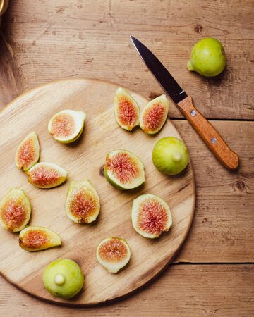 Ripe figs fruit on a wooden board.の写真素材