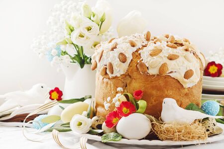 Cake with flowers eggs on white plate.の写真素材
