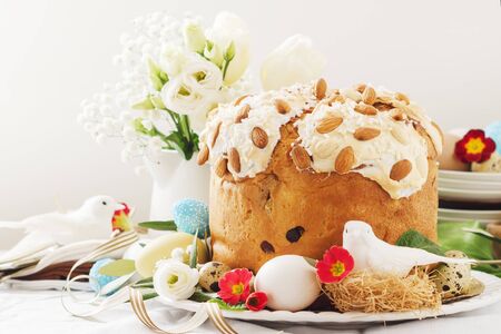 Cake with flowers eggs on white plate.の写真素材