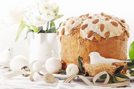 Cake with flowers eggs on white plate.の写真素材