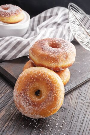 Donuts on black wooden table. Copy spaceの写真素材