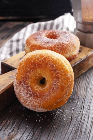 Donuts on black wooden table. Copy spaceの写真素材