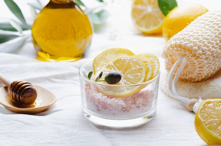 Ingredients for body scrub of pink salt with lemon and olive oil, eco bio friendly cosmetic for skin care.の写真素材