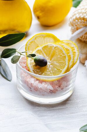 Ingredients for body scrub of pink salt with lemon and olive oil, eco bio friendly cosmetic for skin care.の写真素材