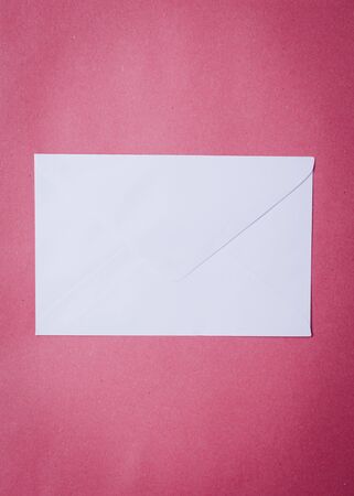 Envelope on pink paper background for Love letter.の写真素材