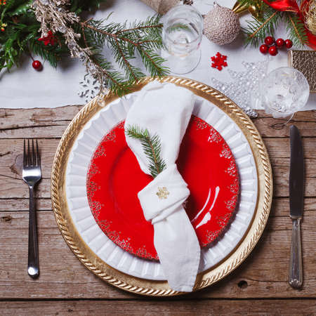 Christmas or New Year table setting. Place setting for Christmas Dinner. Holiday Decorations.の写真素材