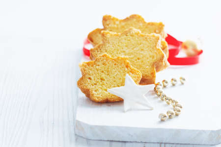Pandoro -typical Italian christmas sweet yeast bread on white wooden table. With free text space.の写真素材