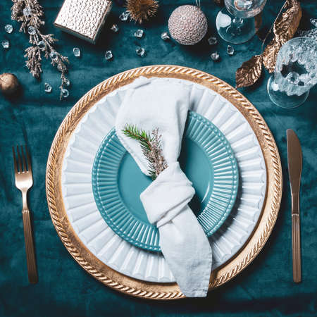 Christmas or New Year table setting. Place setting for Christmas Dinner. Holiday Decorations.の写真素材