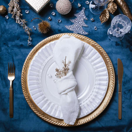 Christmas or New Year table setting. Place setting for Christmas Dinner. Holiday Decorations.の写真素材